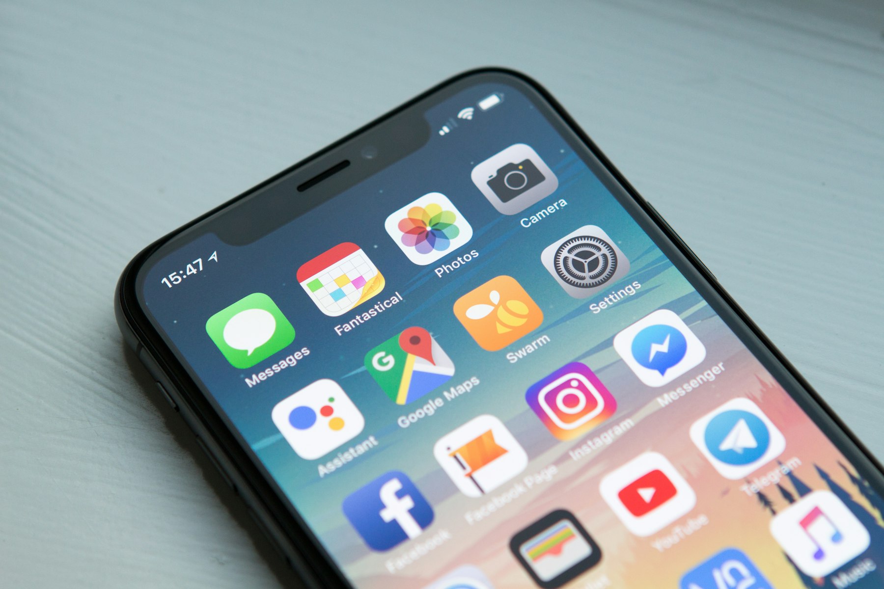 A smartphone with a clear, modern home screen.